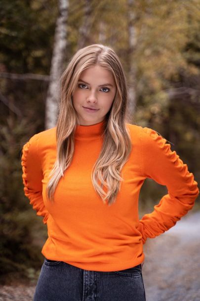 Orange sweater with sleeve detail