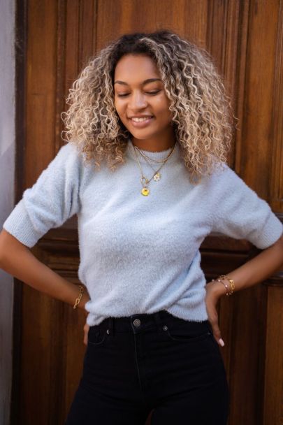 Light blue fluffy sweater with 3/4 length sleeves