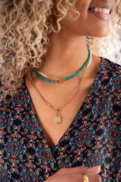 Beaded necklace with gold clasp