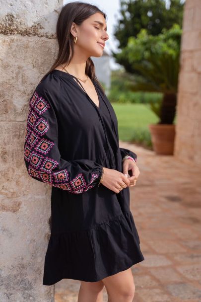 Black loose-fit dress with pink embroidery