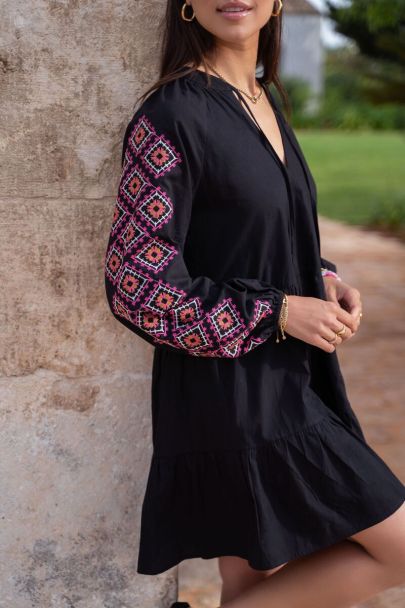Black loose-fit dress with pink embroidery