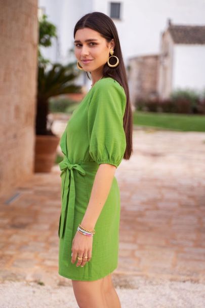 Green puff-sleeved wrap dress with bow