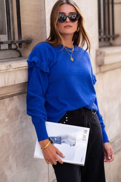Blue jumper with ruffles