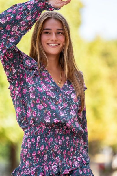 Dark green ruffled top with pink floral print