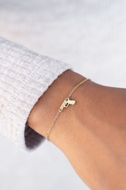 Bracelet with gun charm