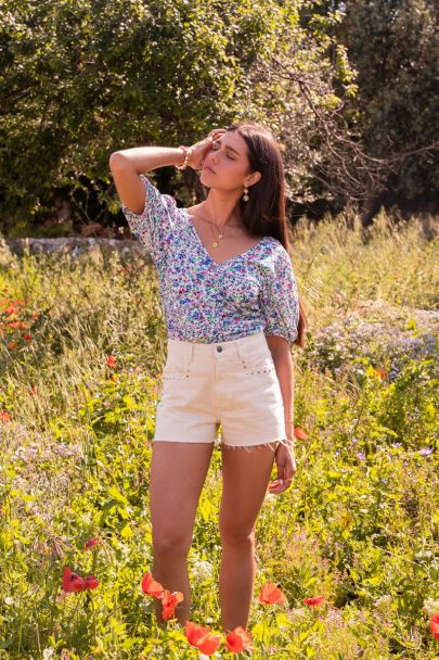 White pleated top with blue floral print