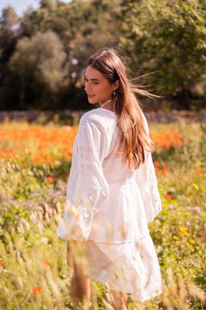 White dress with embroidered sleeves