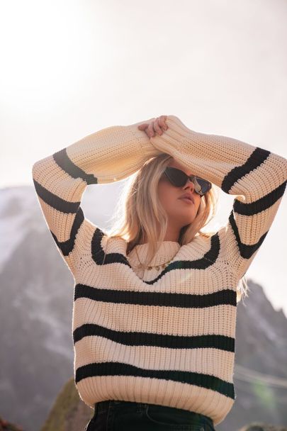 White knit sweater with black stripes