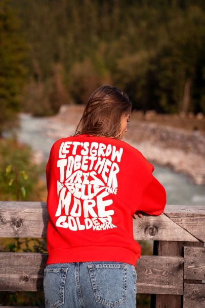 Red sweater let's grow together