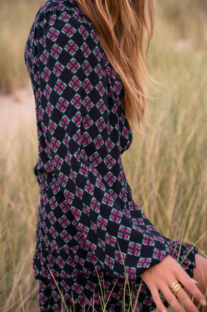 Black one-shoulder top with pink print