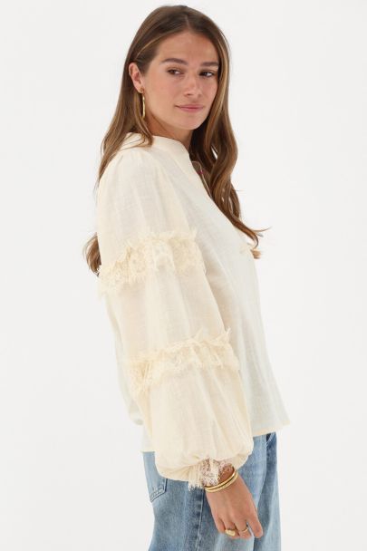 Beige blouse with lace details
