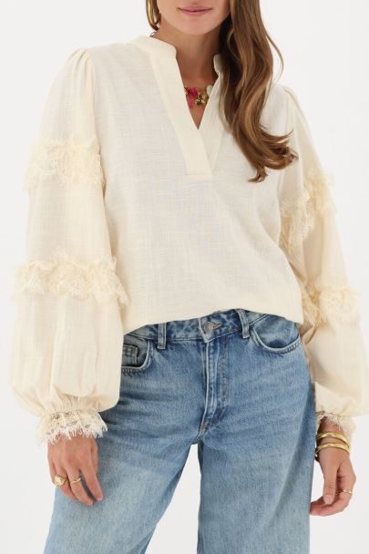 Beige blouse with lace details
