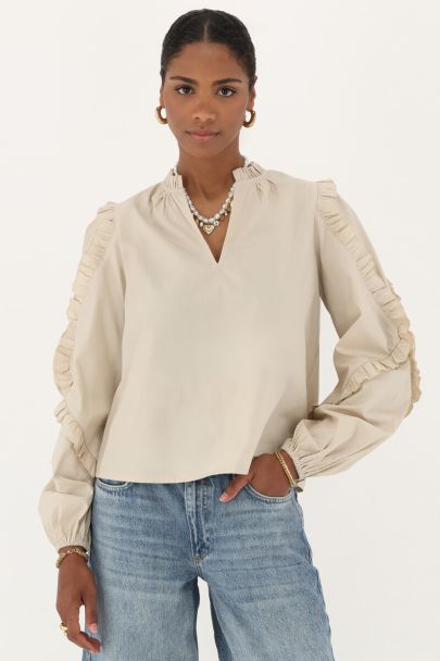 Beigefarbene Bluse mit Rüschen