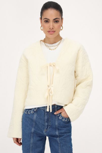 Beige bomber jas