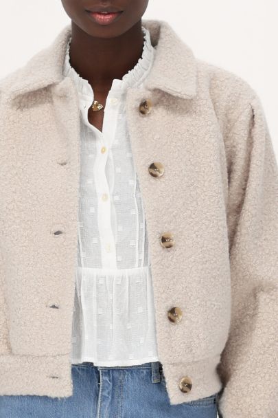 Beigefarbene Bouclé-Jacke