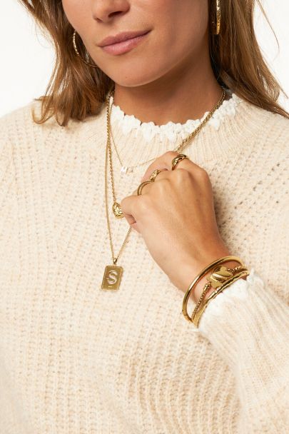 Beige gebreide trui met crochet details