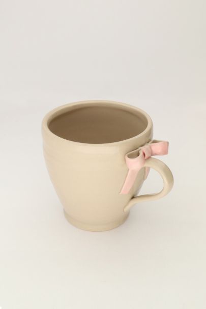 Tasse beige avec noeud