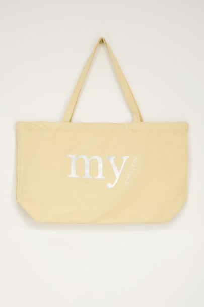 Light yellow tote bag with silver coloured "My Jewellery" logo