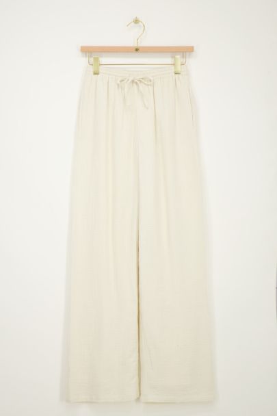 Beigefarbene Hose mit elastischem Bund und Kordelzug