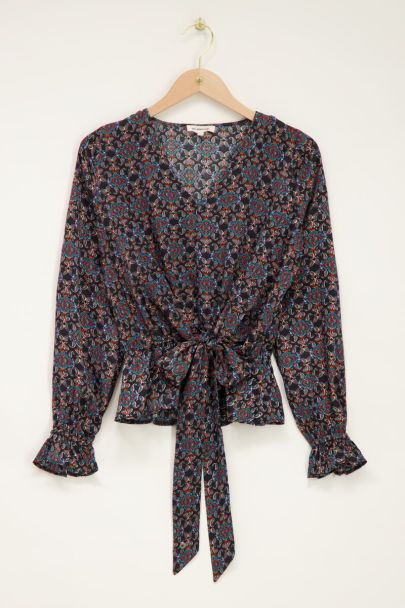 Black belted top with multicoloured print