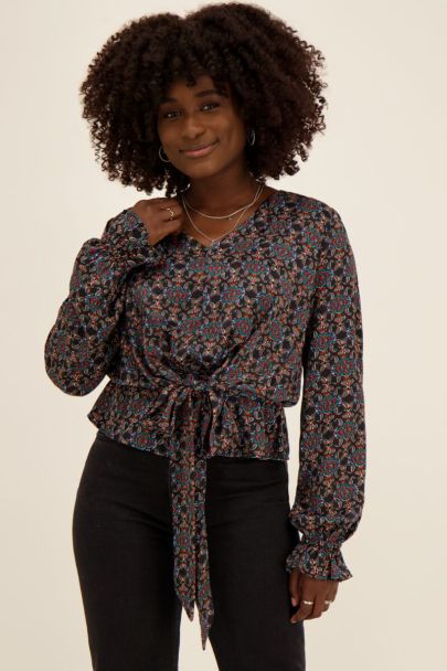 Black belted top with multicoloured print