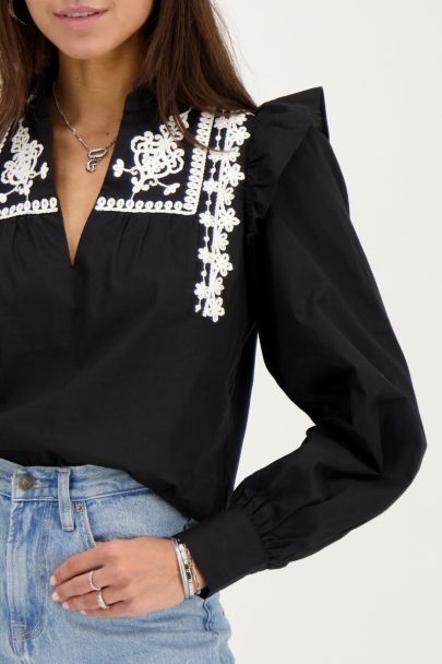 Black blouse with embroidery and ruffles