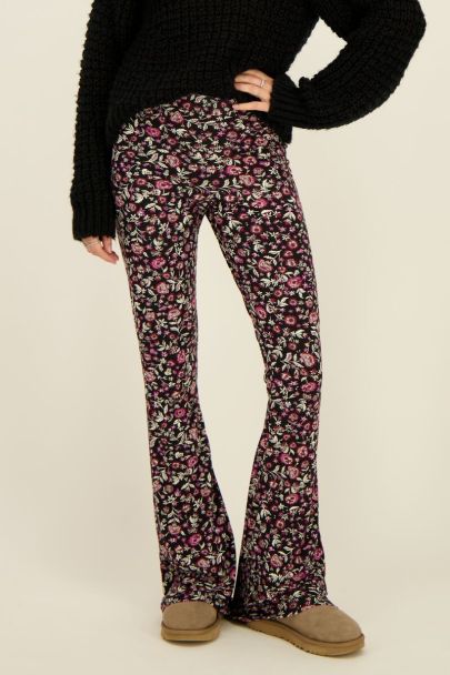 Black flared trousers with red floral print