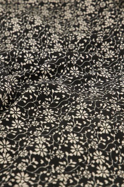 Black dress with beige flowers