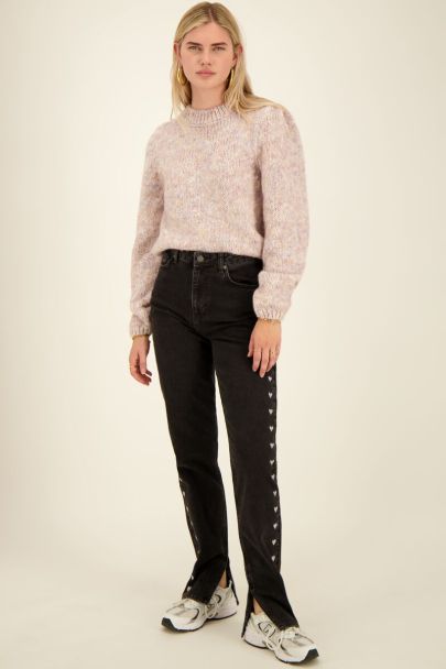 Black split jeans with embroidered hearts