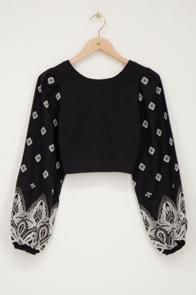 Black top with tie-back and embroidery