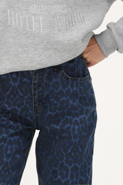 Blue denim jeans with leopard print
