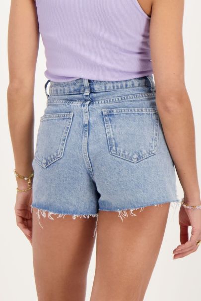 Blue denim skort with faux pearls