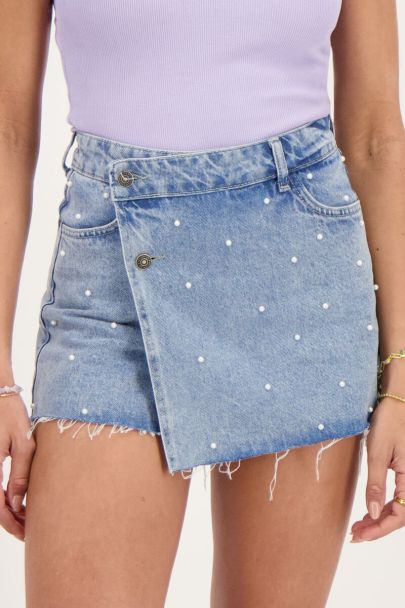 Blue denim skort with faux pearls