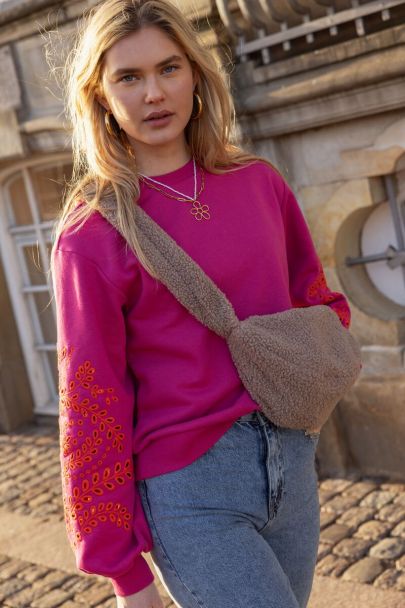 Pink sweater with embroidered sleeves
