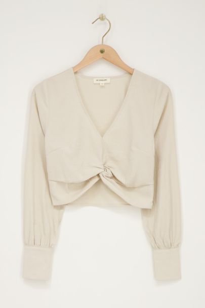 Crème top met knoop & structuur