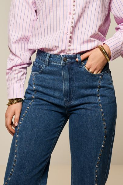 Jean large bleu foncé à clous ondulés