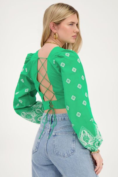 Green top with tie back and embroidery