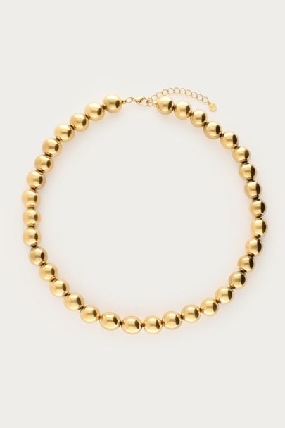 Gold-coloured statement necklace chunky beads