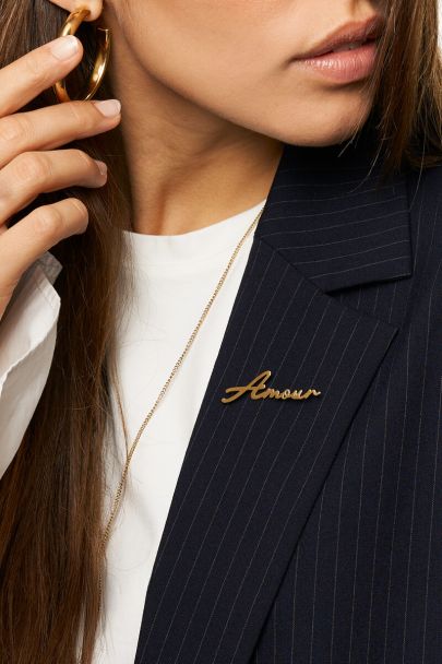 Goudkleurige broche Amour