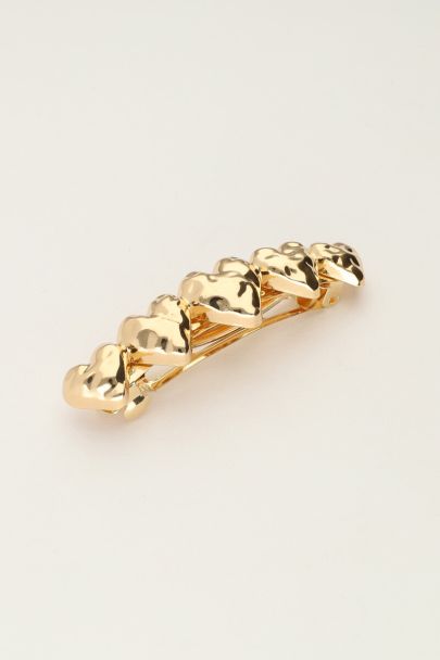 Gold coloured hair clip with five hearts