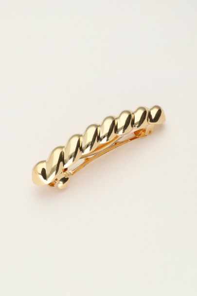Gold coloured hair pin with twist