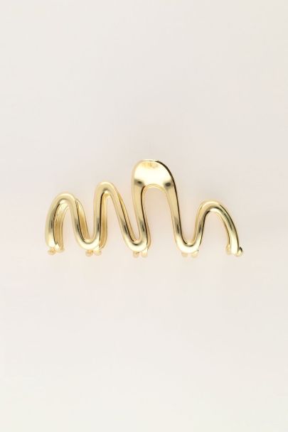 Gold coloured hair clip with twist