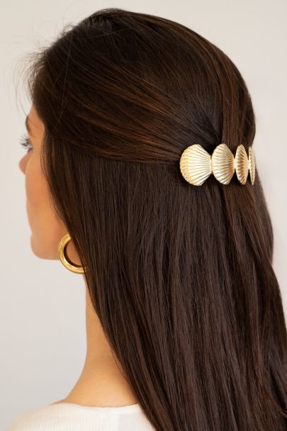 Gold coloured hairpin with four shells