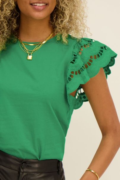 Green top with embroidered sleeves