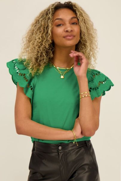 Green top with embroidered sleeves