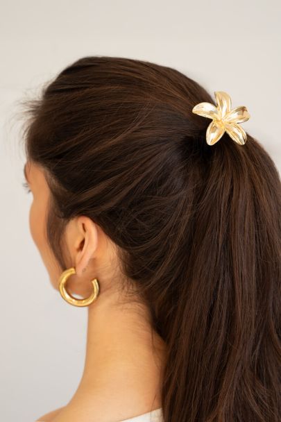Hair elastic with gold coloured flower