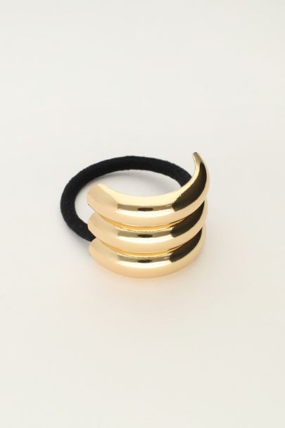 Hair tie with triple gold coloured curve