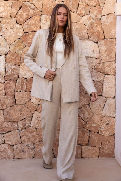 Beige linen look trousers with button fastening