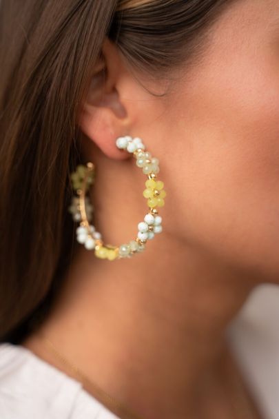 Large hoop earrings with green flowers