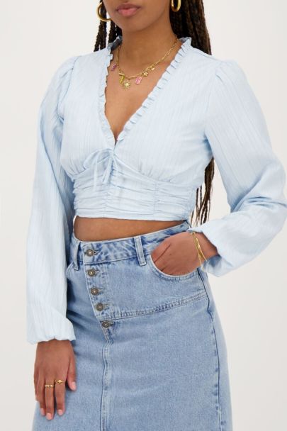 Light blue crop top with ruffles and smock